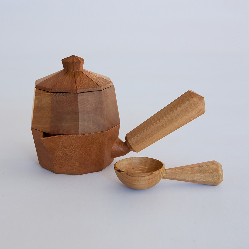 Hand-carved coffee or tea pot